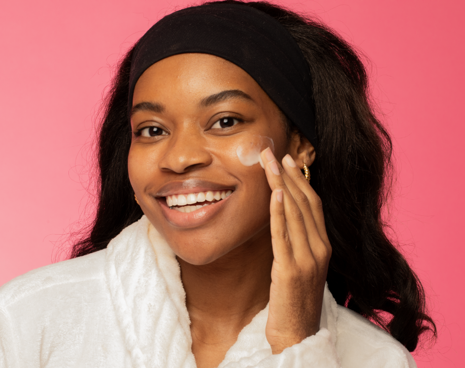 Woman applying Good Molecules skincare